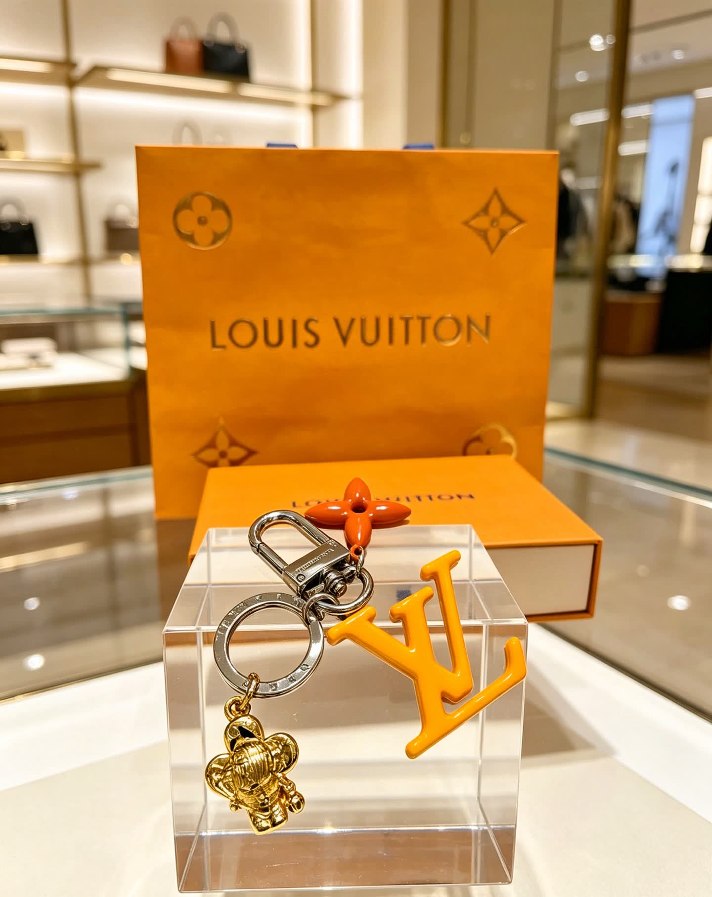 Louis Vuitton Keychain with LV Logo and Monogram Motif Louis Vuitton Keychain with LV Logo and Monogram Motif